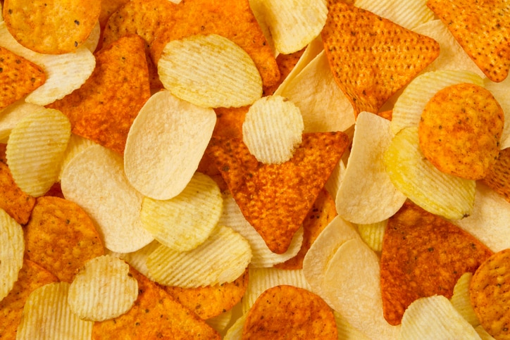 Heap of potato and tortilla chips background