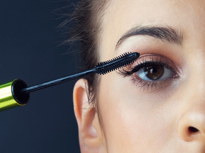 Cropped shot of a beautiful young woman applying mascara