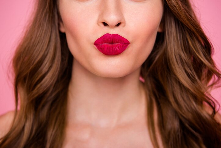 Cropped close up photo amazing beautiful she her lady attractive show ideal plump rose lips pomade lipstick hide eyes wear cute shiny colorful dress isolated pink rose bright vivid background.