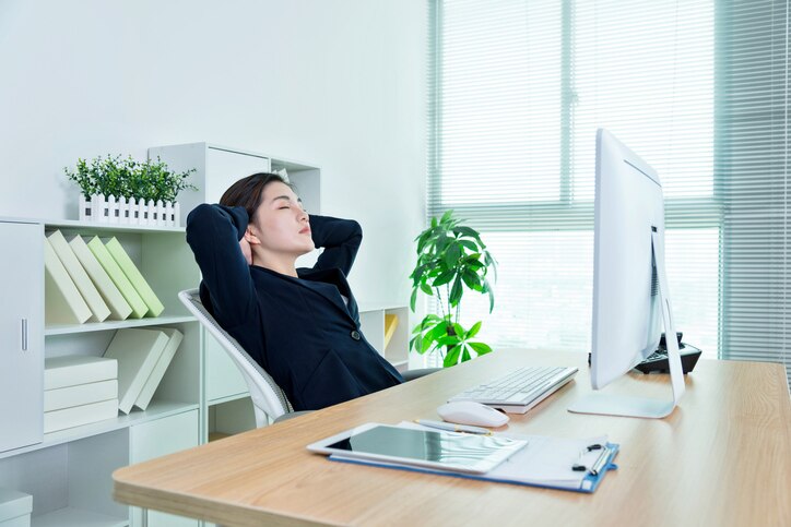 Businesswoman taking a break in office chair