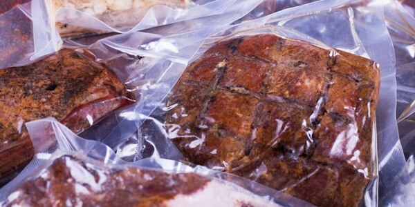 Meat pieces in different packages. Lard and other meat in package.