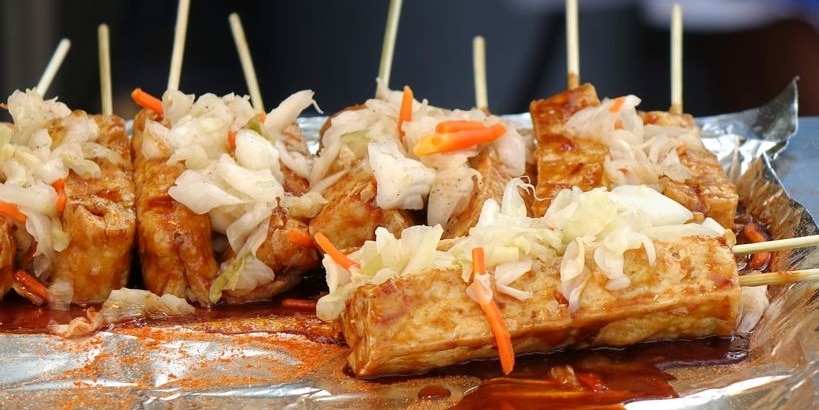 Stinky fermented tofu with pickled cabbage and hot sauce is popular in Taiwan