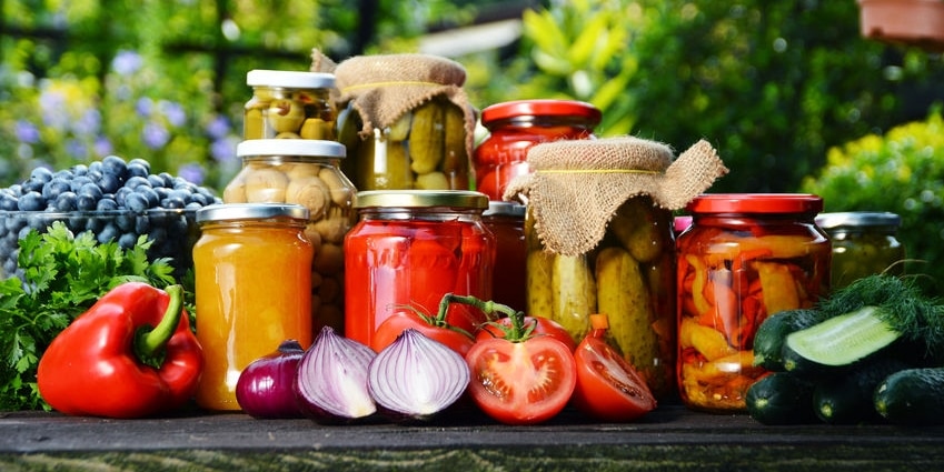 32315020 - jars of pickled vegetables in the garden. marinated food.